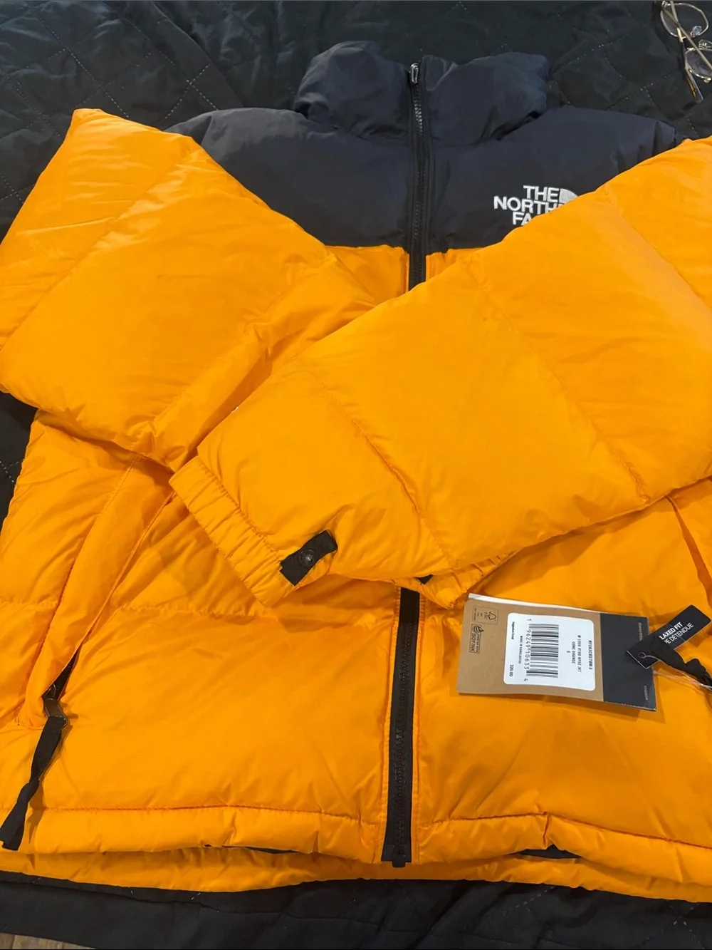 The North Face Men’s Orange and Black Puffer Jacket